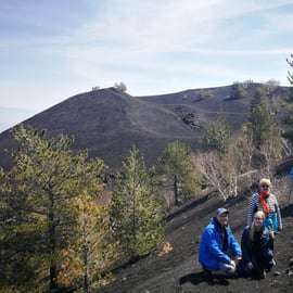 Mount Etna at sunset: pick-up from Catania, with guide, food tasting, and cave kit