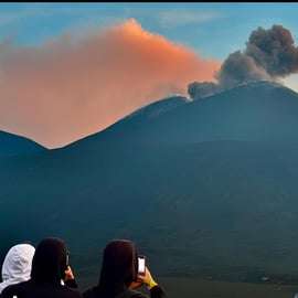 Mount Etna at sunset: pick-up from Catania, with guide, food tasting, and cave kit