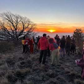 Mount Etna at sunset: pick-up from Catania, with guide, food tasting, and cave kit